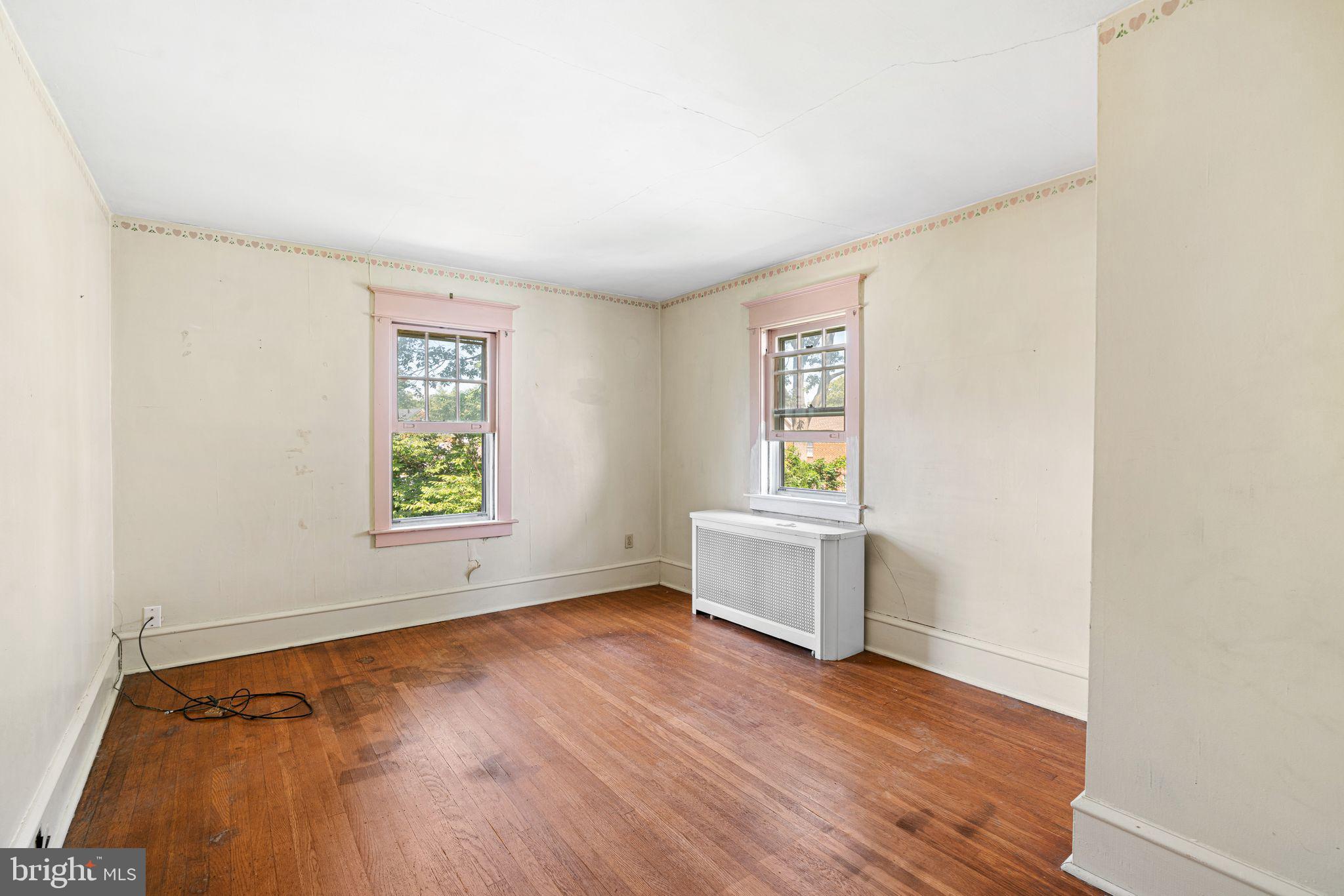 404 Grove Street Haddonfield, NJ 08033 - Photo 14 of 30 an empty room with window and wooden floor
