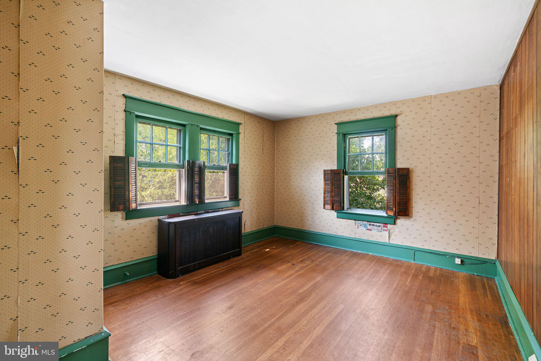 404 Grove Street Haddonfield, NJ 08033 - Photo 16 of 30 an empty room with wooden floor and windows