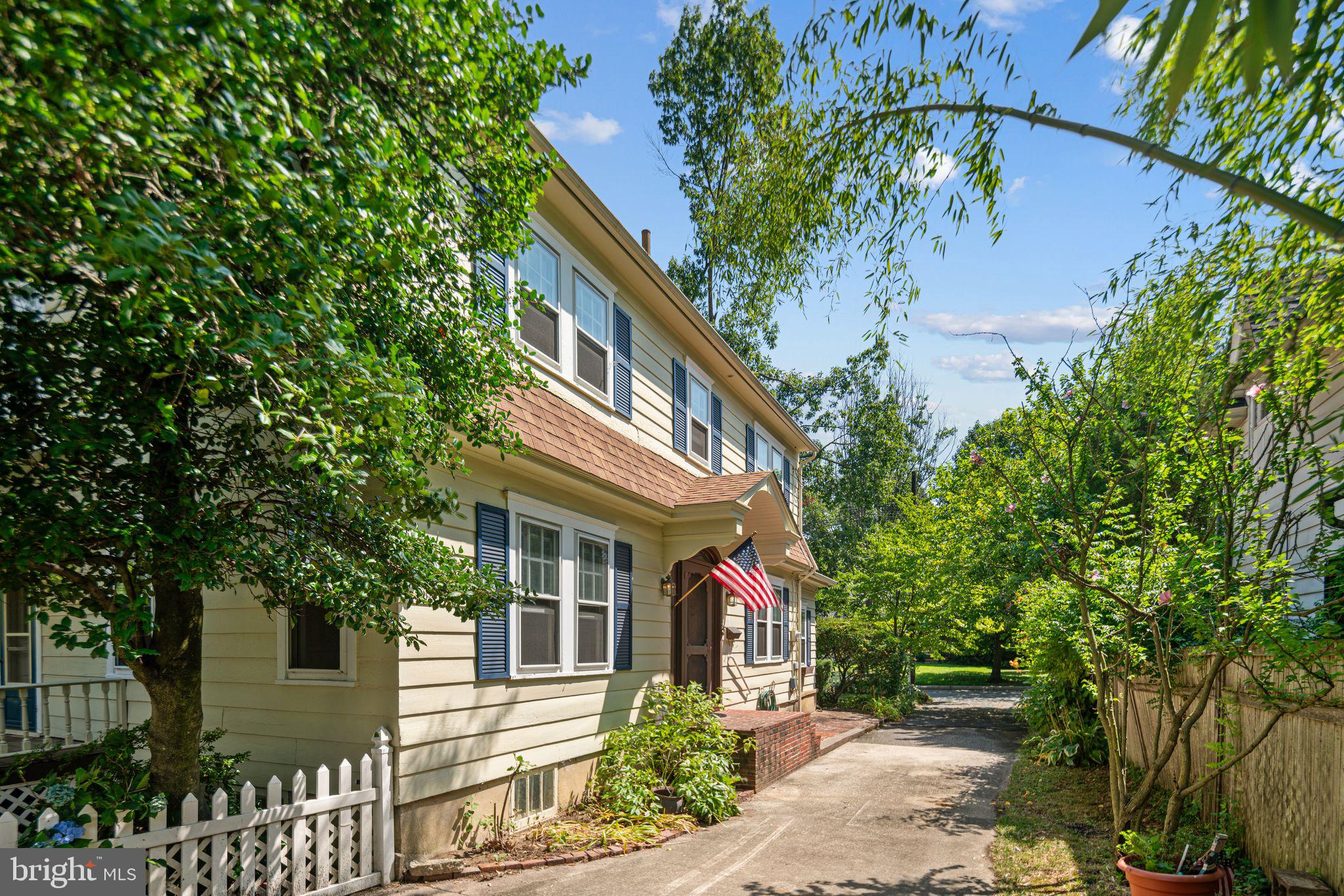 404 Grove Street Haddonfield, NJ 08033 - Photo 3 of 30 a front view of a house with a tree