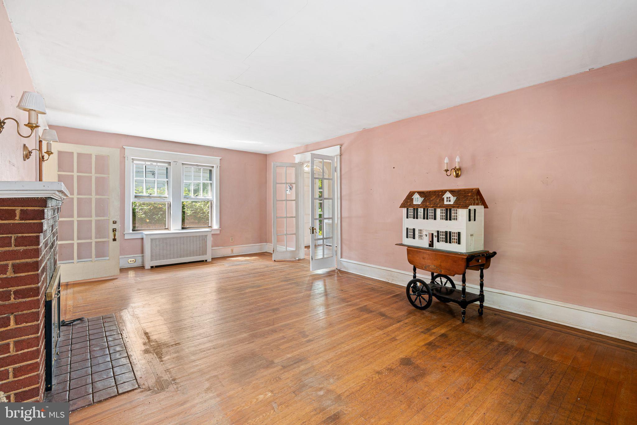 404 Grove Street Haddonfield, NJ 08033 - Photo 7 of 30 a view of a livingroom with wooden floor and a window