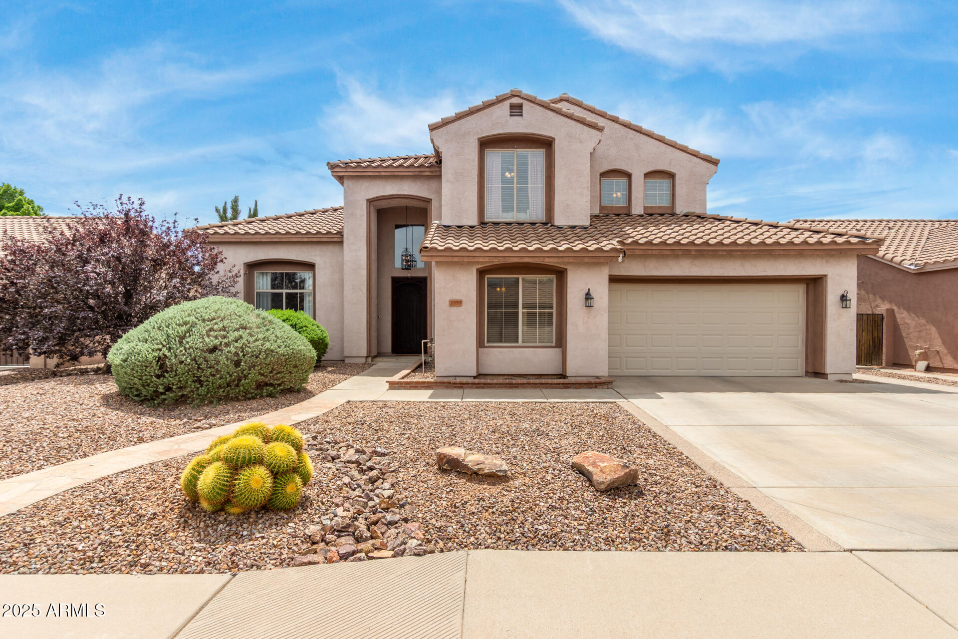 a front view of a house with garage