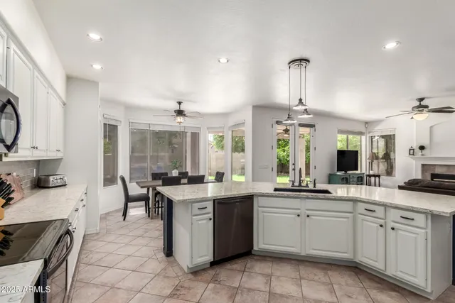 a kitchen with a sink stove and cabinets