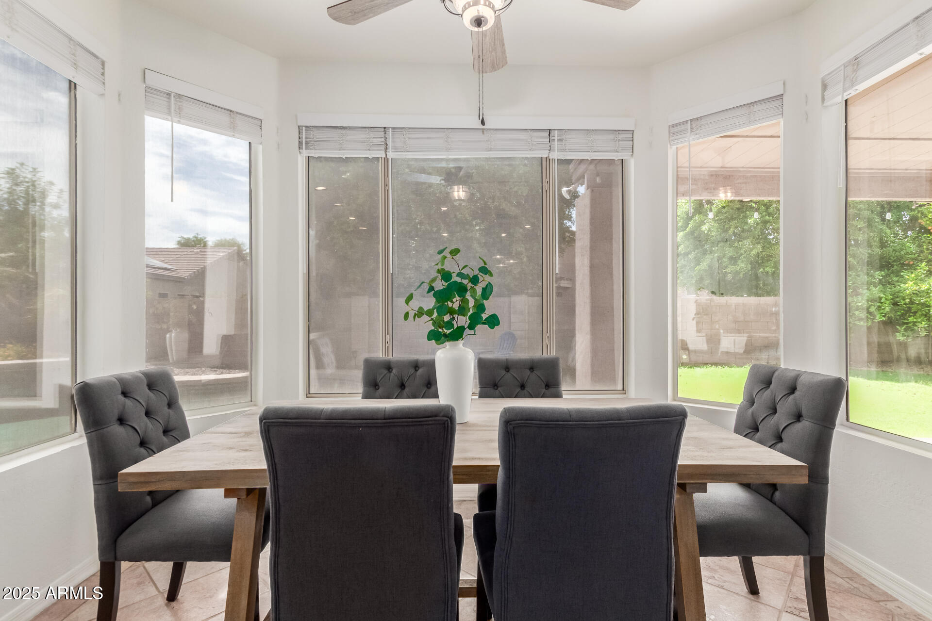2859 East Millbrae Lane Gilbert, AZ 85234 - Photo 14 of 42 a view of a dining room with furniture window and outside view
