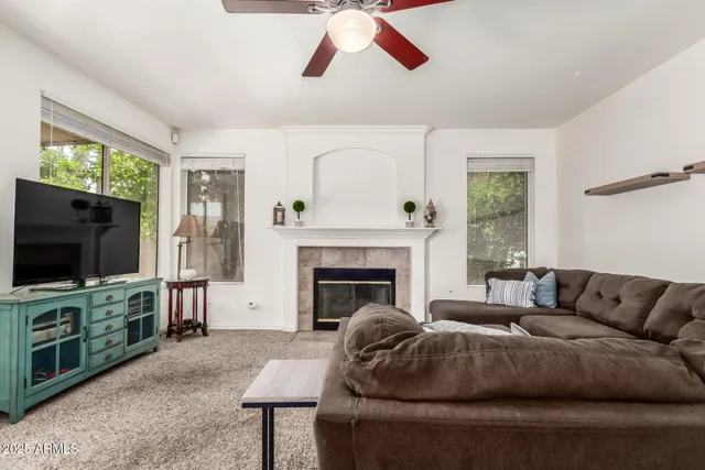 a living room with furniture and a flat screen tv