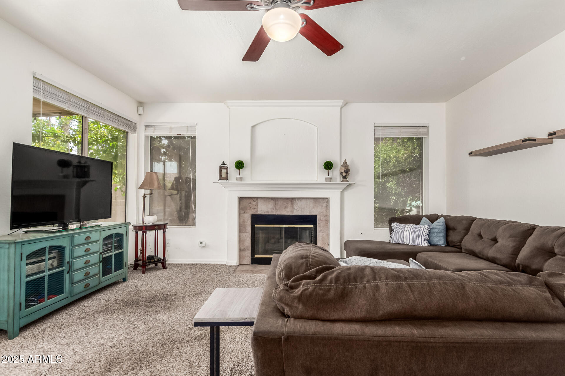 2859 East Millbrae Lane Gilbert, AZ 85234 - Photo 15 of 42 a living room with furniture and a flat screen tv