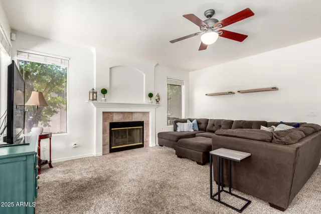 a living room with furniture and a fireplace