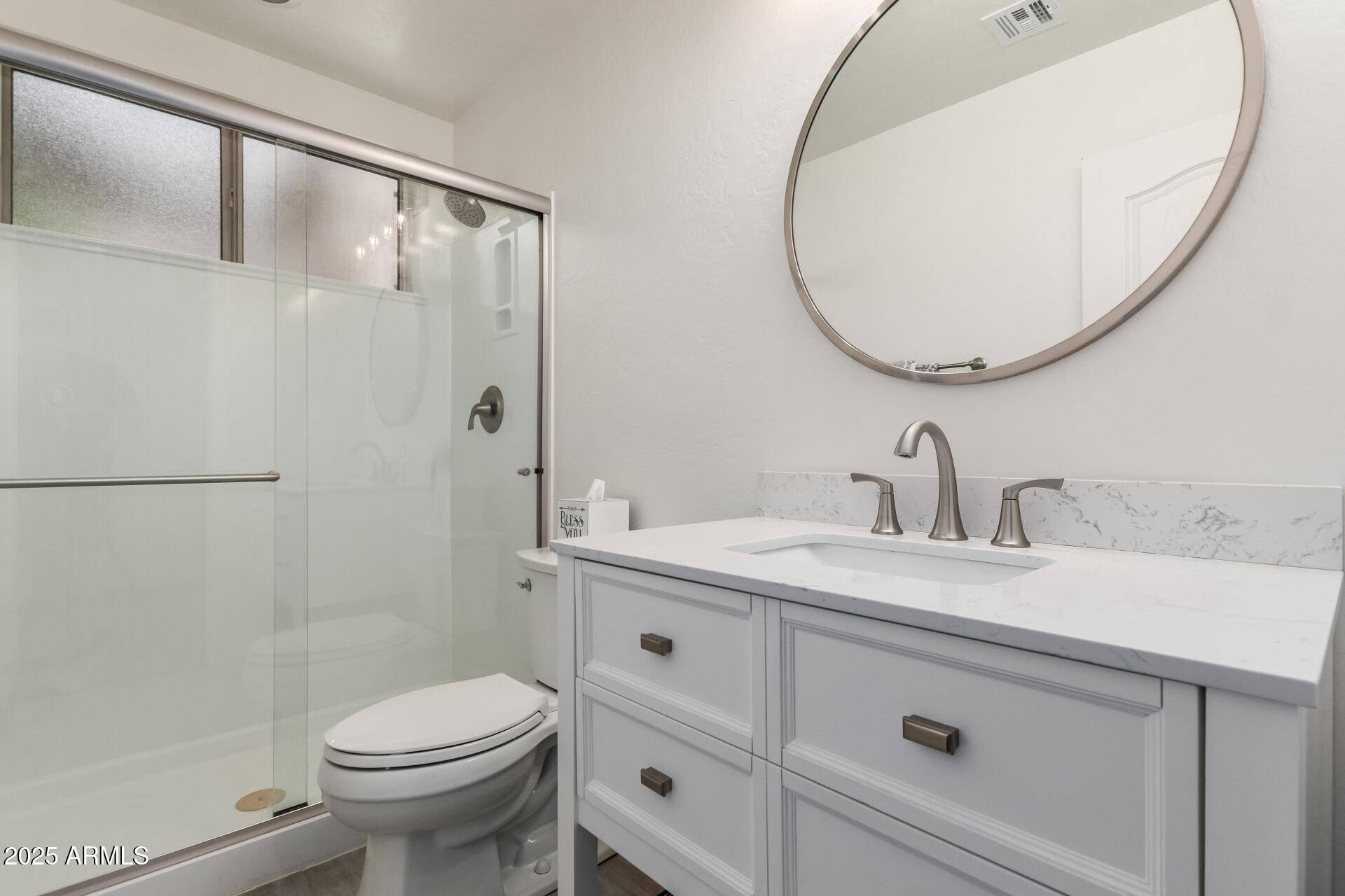 2859 East Millbrae Lane Gilbert, AZ 85234 - Photo 19 of 42 a bathroom with a sink a toilet and a mirror