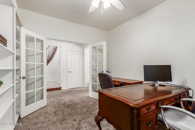 a view of a workspace with furniture
