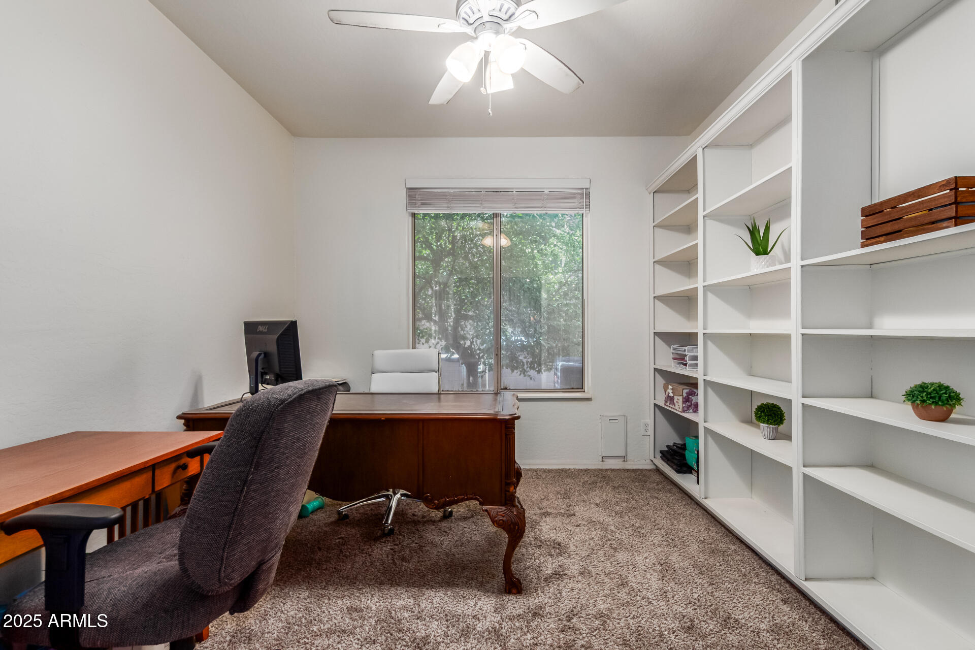 2859 East Millbrae Lane Gilbert, AZ 85234 - Photo 21 of 42 a view of a workspace with furniture and a window