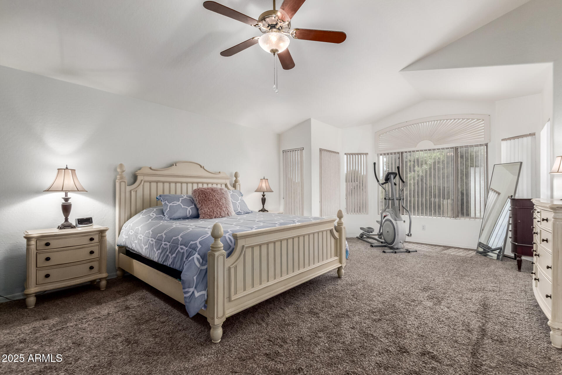2859 East Millbrae Lane Gilbert, AZ 85234 - Photo 23 of 42 a bedroom with a bed and a chandelier