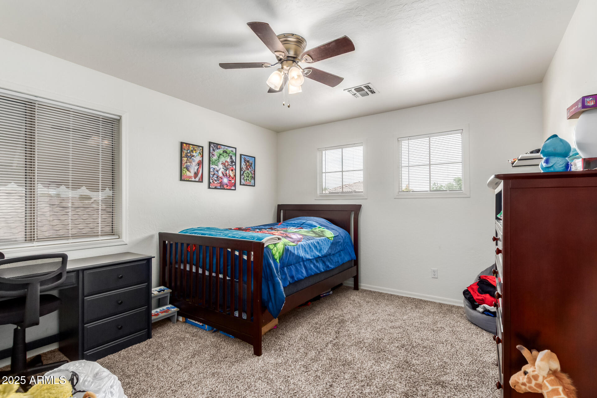 2859 East Millbrae Lane Gilbert, AZ 85234 - Photo 33 of 42 a bedroom with a bed and a window