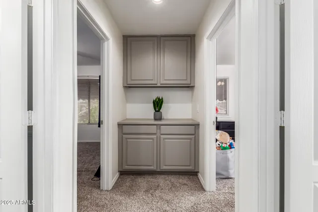 a view of cabinets a washer and dryer