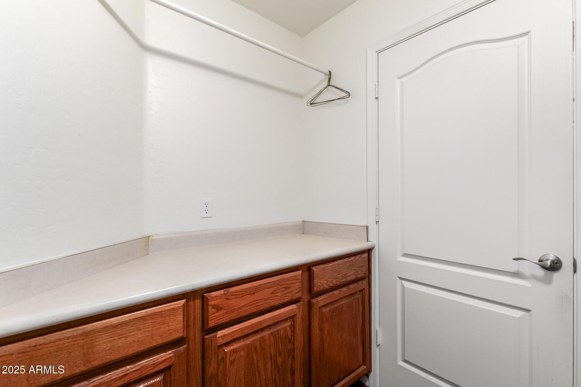2859 East Millbrae Lane Gilbert, AZ 85234 - Photo 37 of 42 a room with linen closet and wooden floor