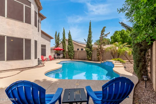 a view of a swimming pool with patio