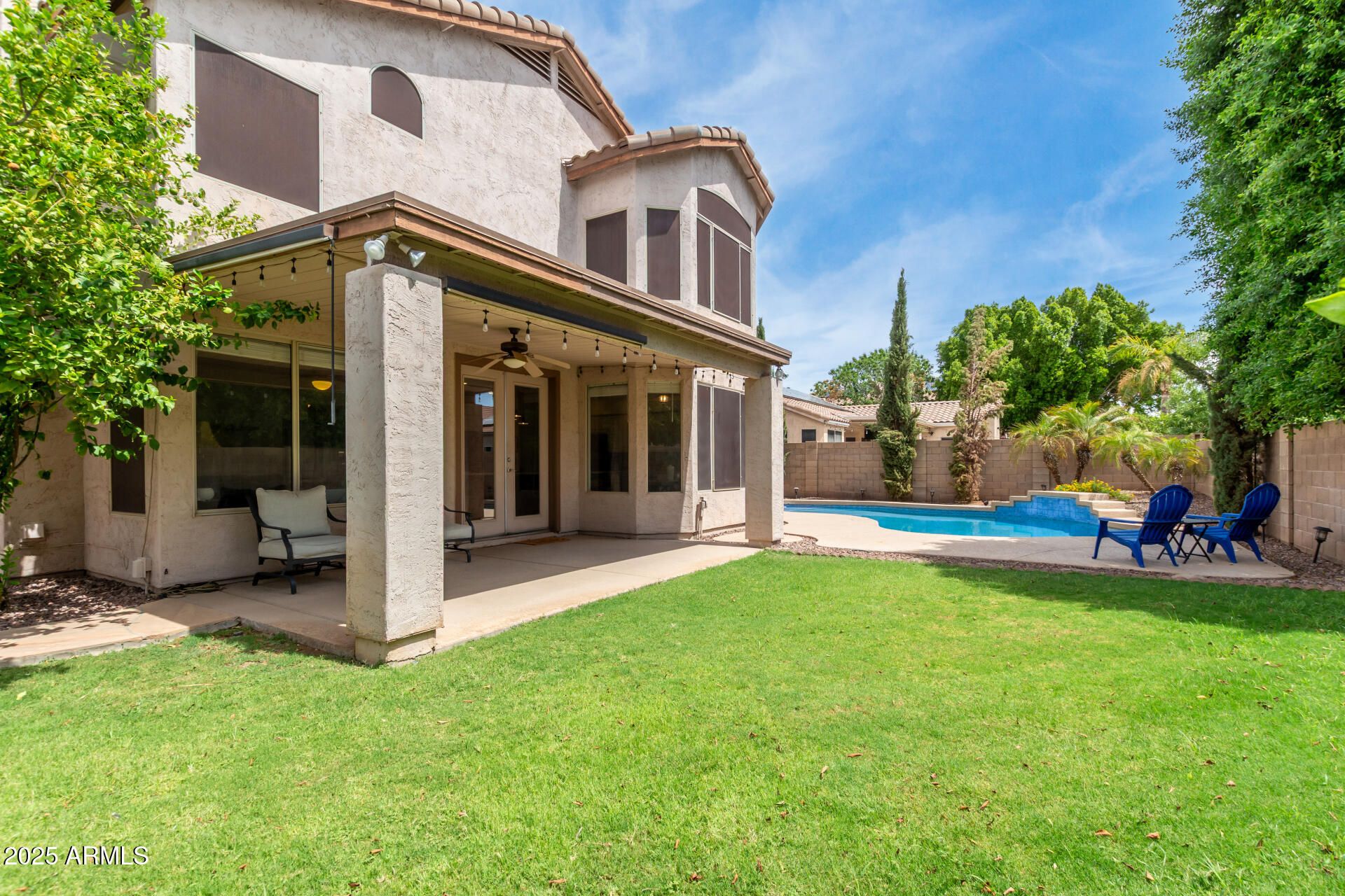 2859 East Millbrae Lane Gilbert, AZ 85234 - Photo 4 of 42 a view of a house with a yard and plants