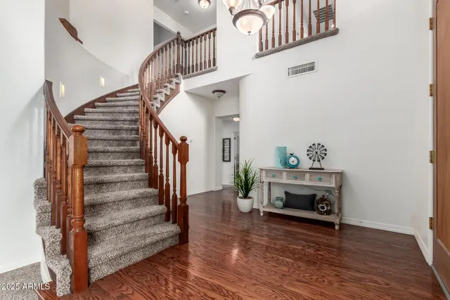 a view of entryway livingroom and hall with wooden floor