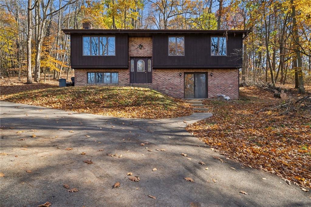 6149 Baker School Road Trafford, PA 15085 - Photo 1 of 30 a front view of a house with garden