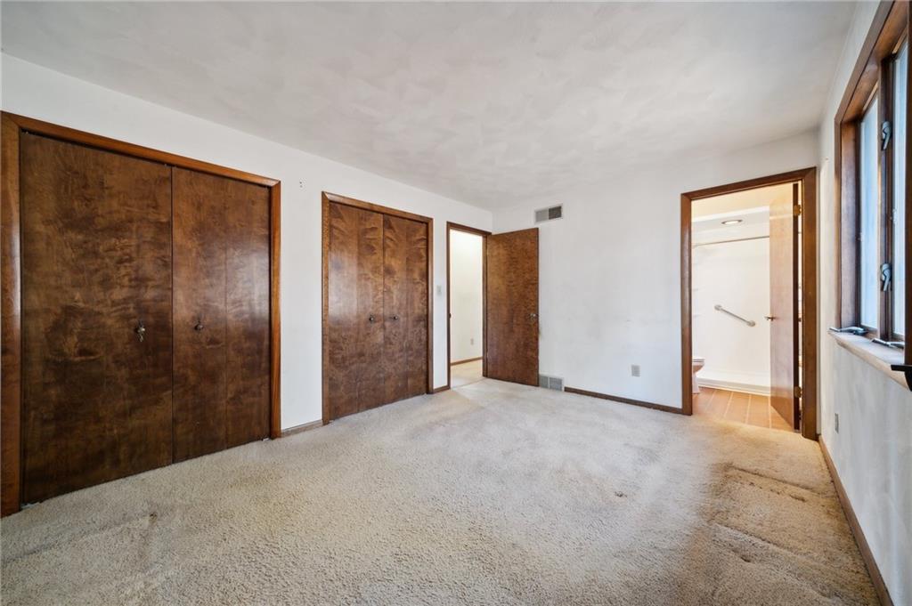 6149 Baker School Road Trafford, PA 15085 - Photo 14 of 30 a view of a big room with closet and windows