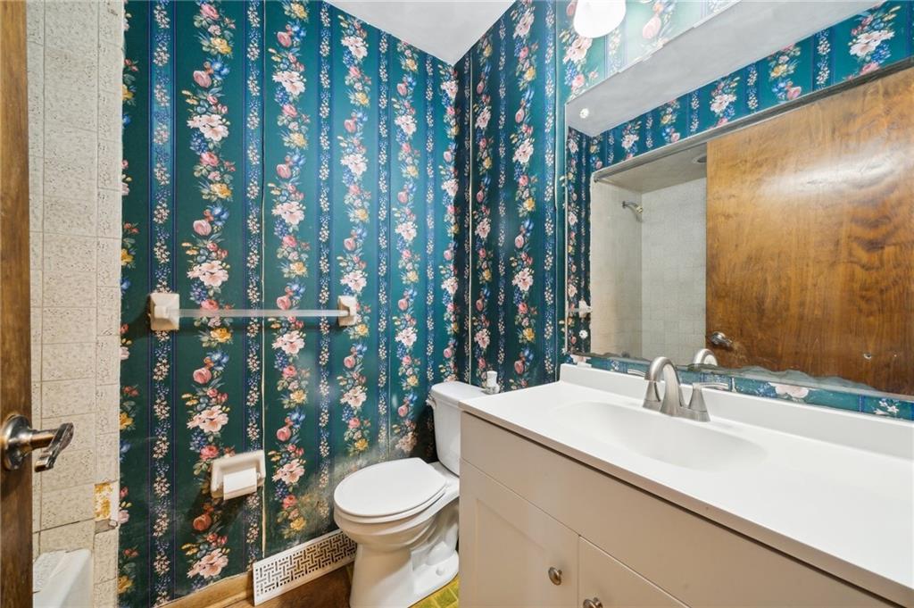 6149 Baker School Road Trafford, PA 15085 - Photo 18 of 30 a bathroom with a sink a toilet a mirror and shower curtain