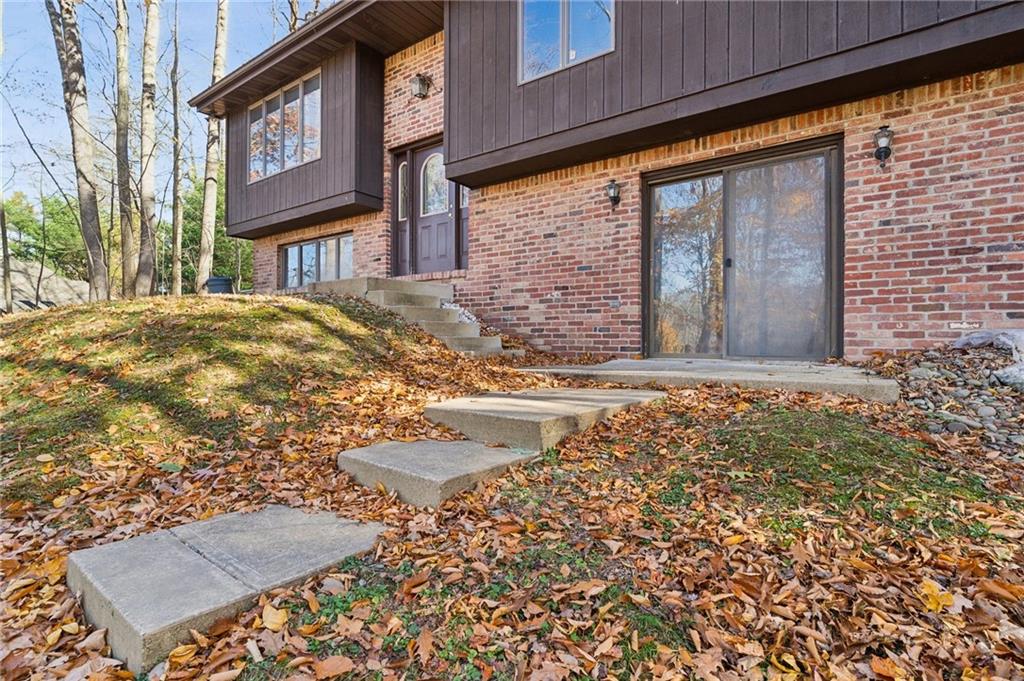 6149 Baker School Road Trafford, PA 15085 - Photo 2 of 30 a view of a brick building with many windows