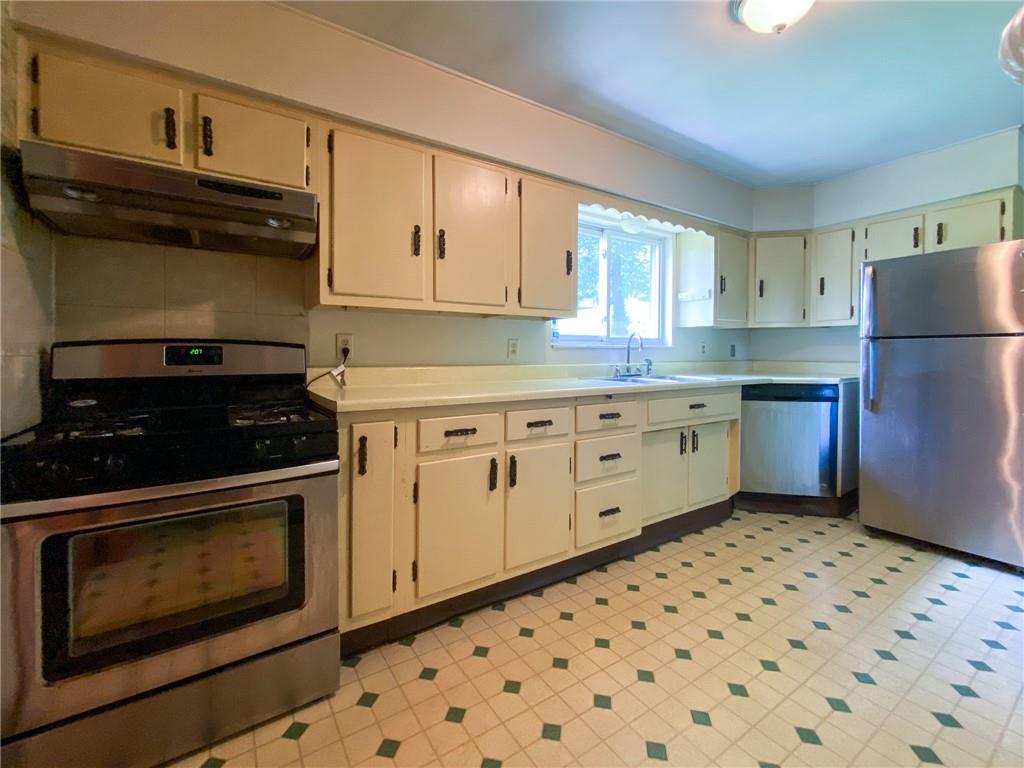128 Clover Drive Monaca, PA 15061 - Photo 7 of 19 a kitchen with granite countertop cabinets and steel stainless steel appliances