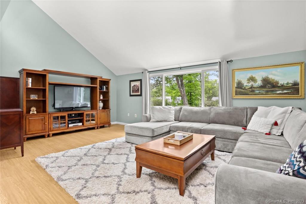 1 Nectar Lane, Unit 1 Ridgefield, CT 06877 - Photo 1 of 1 a living room with furniture and a flat screen tv