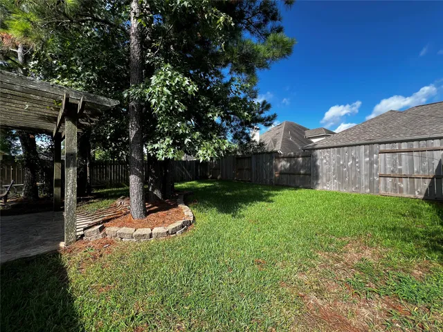 a backyard of a house with lots of green space