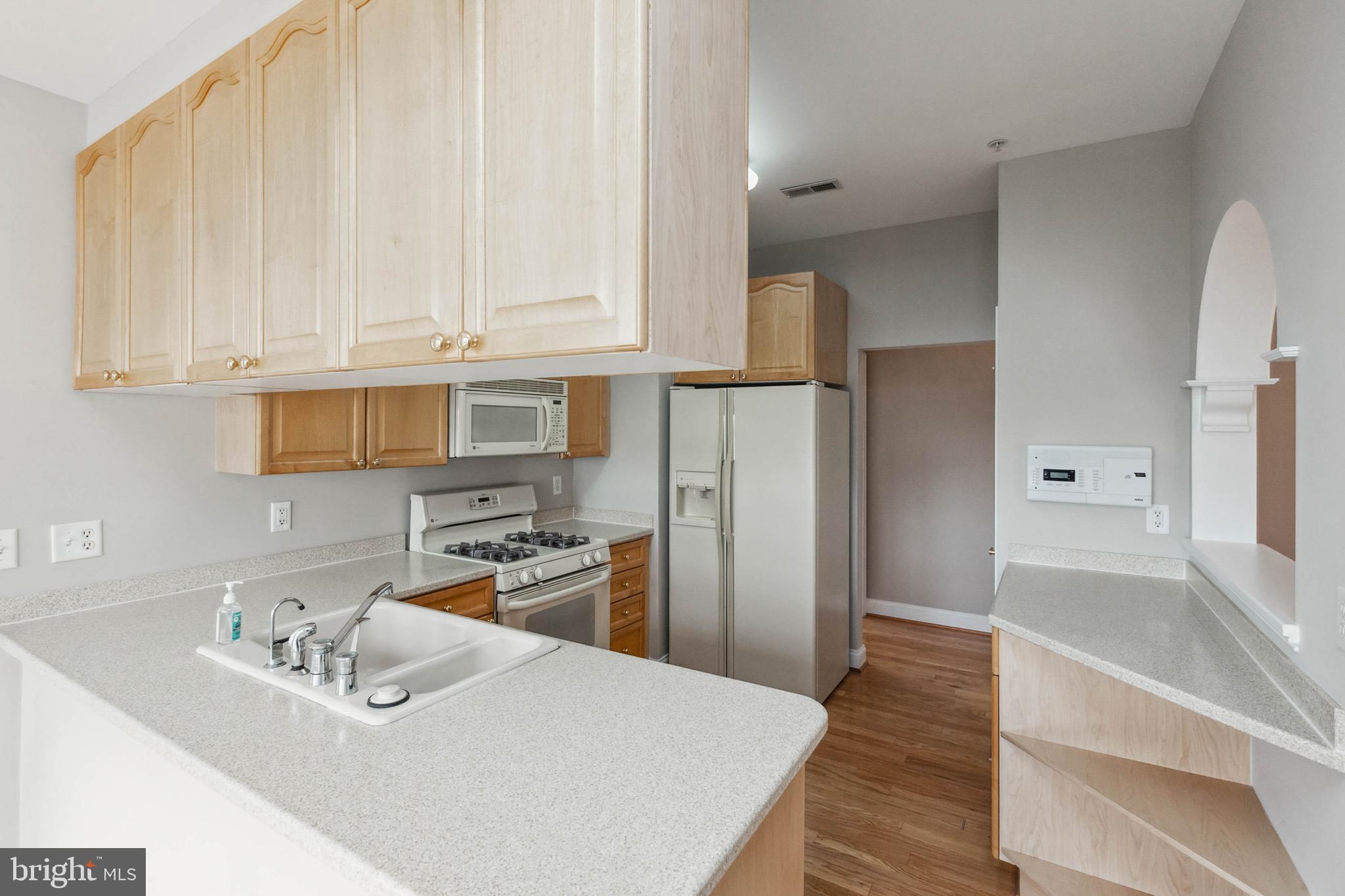 2500 Waterside Drive, Unit 405 Frederick, MD 21701 - Photo 18 of 45 Maple cabinets and Corian countertops!