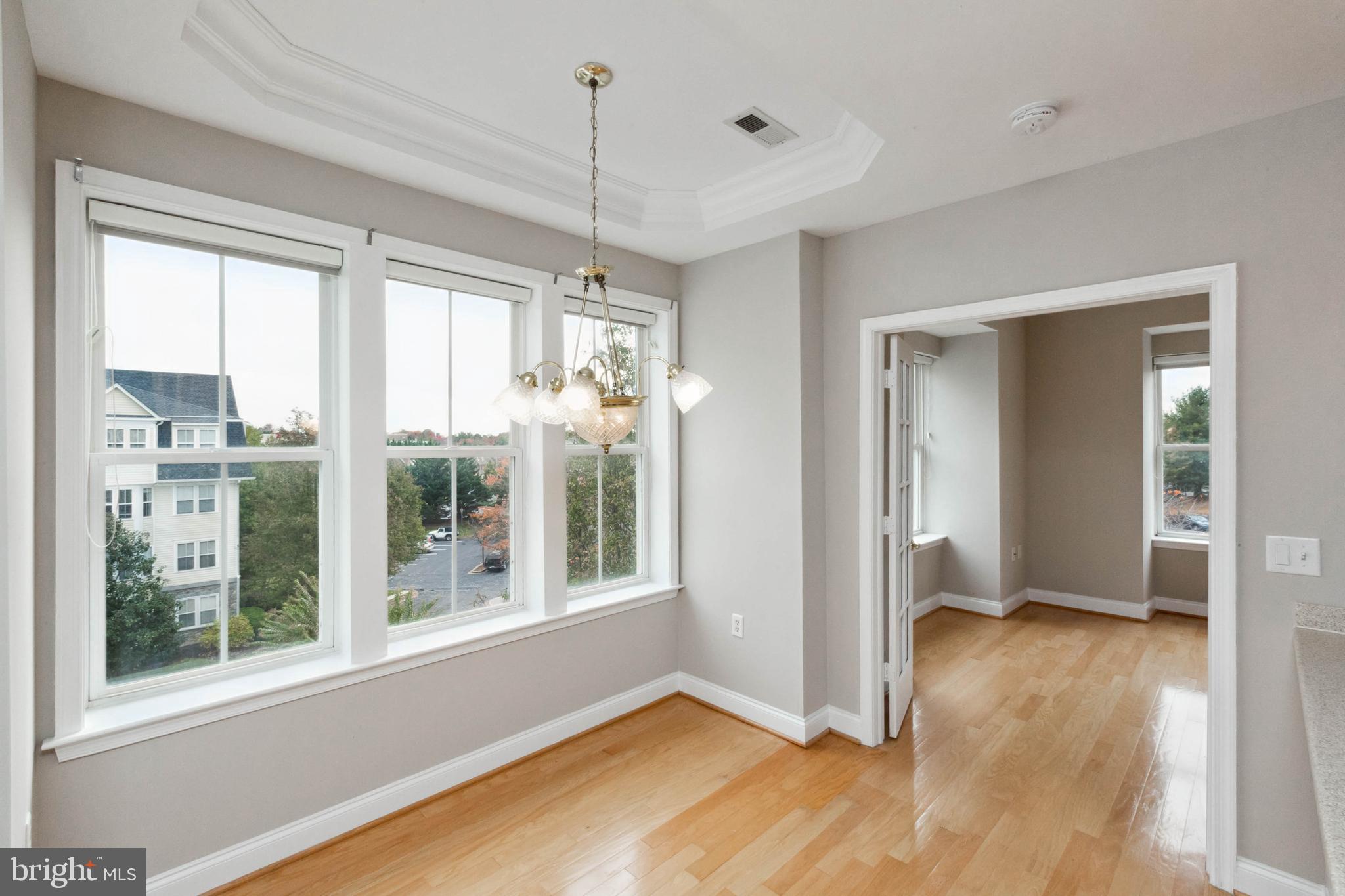 2500 Waterside Drive, Unit 405 Frederick, MD 21701 - Photo 21 of 45 Tray ceiling! So many windows means so much light!
