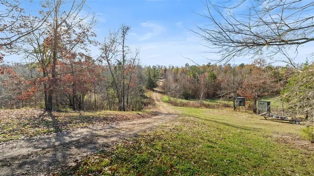 an aerial view of a house with yard