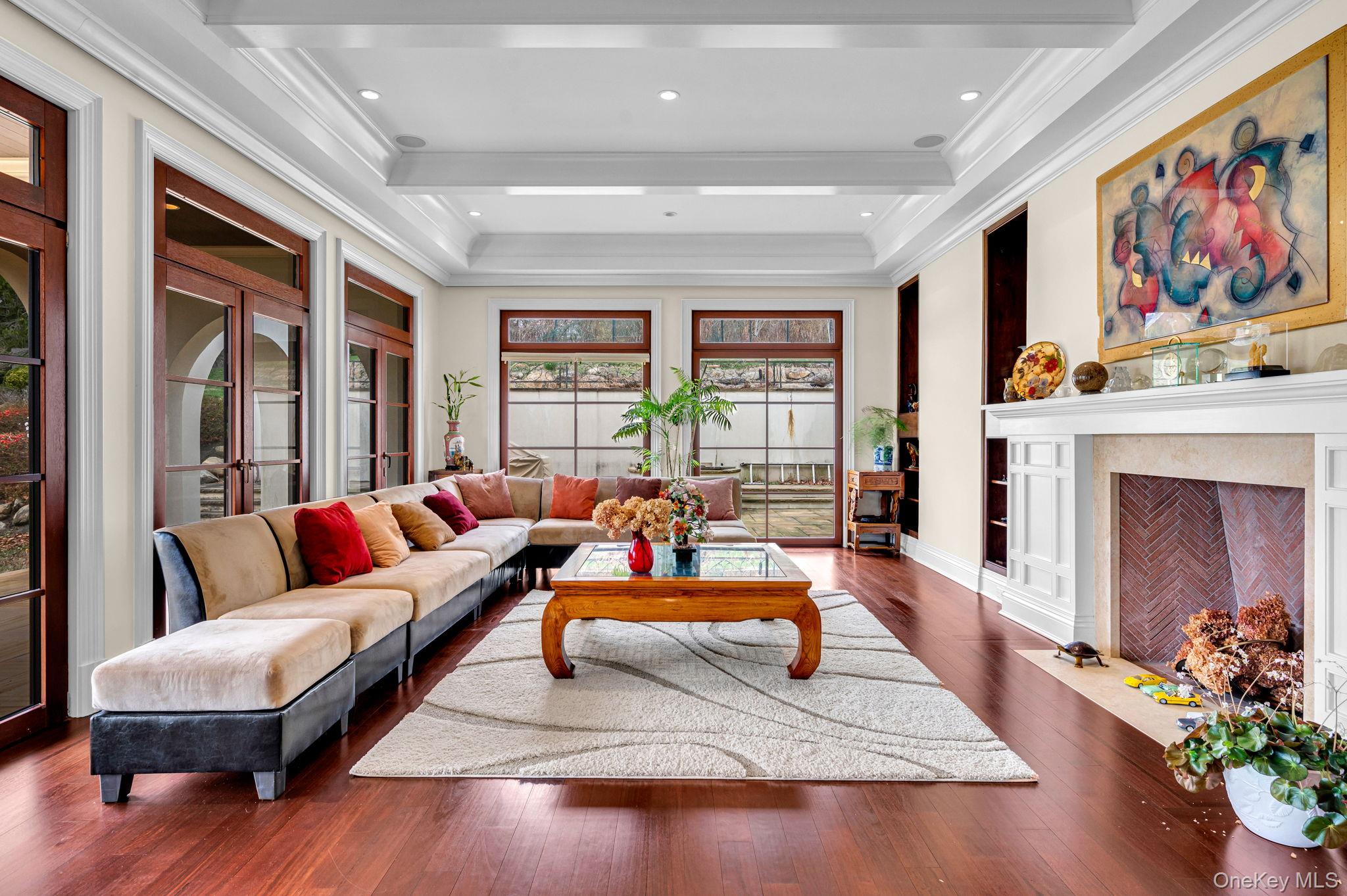 717 Short Beach Road St. James, NY 11780 - Photo 15 of 47 a living room with furniture fireplace and potted plants