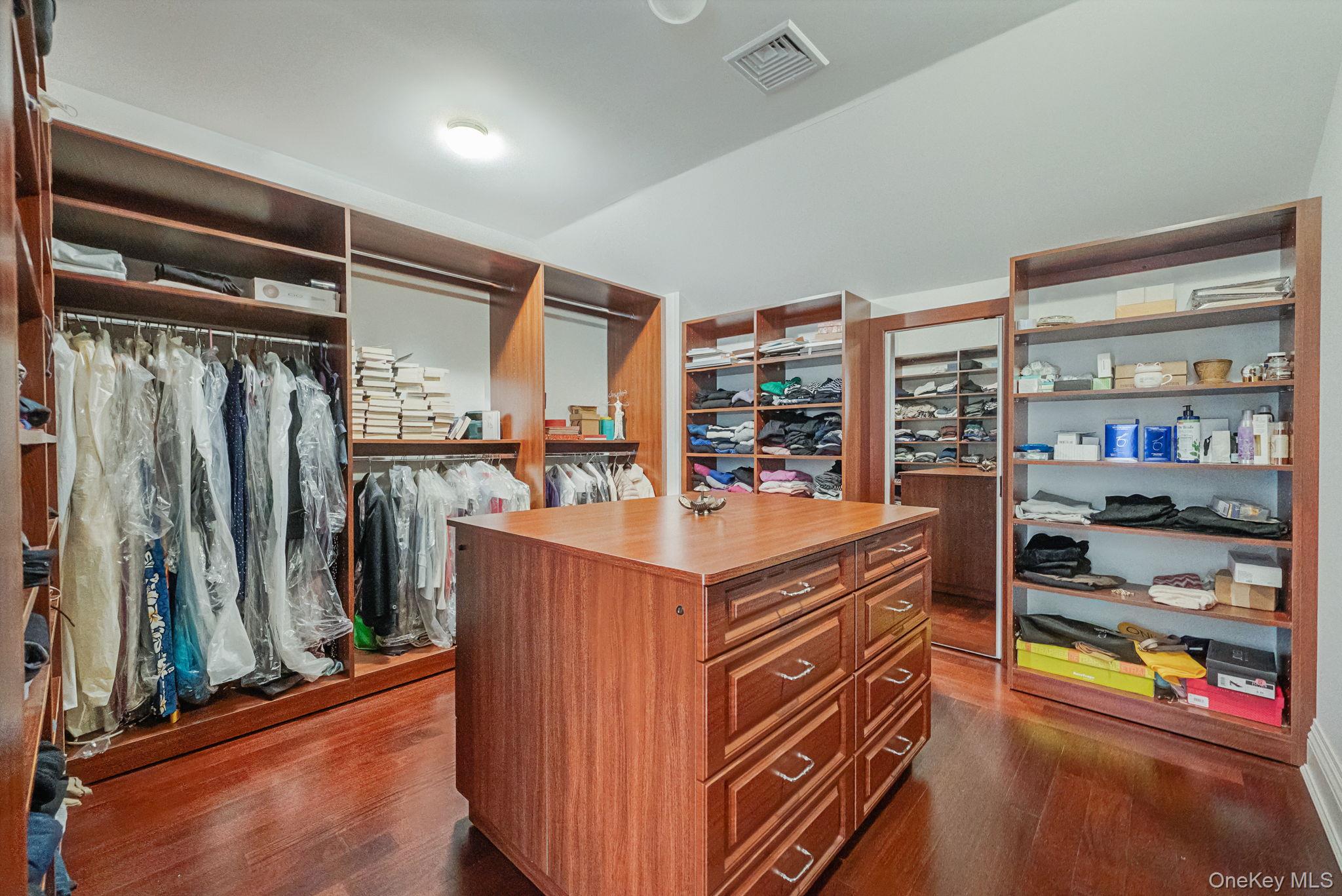 717 Short Beach Road St. James, NY 11780 - Photo 22 of 47 a view of walk in closet with clothes and shoes