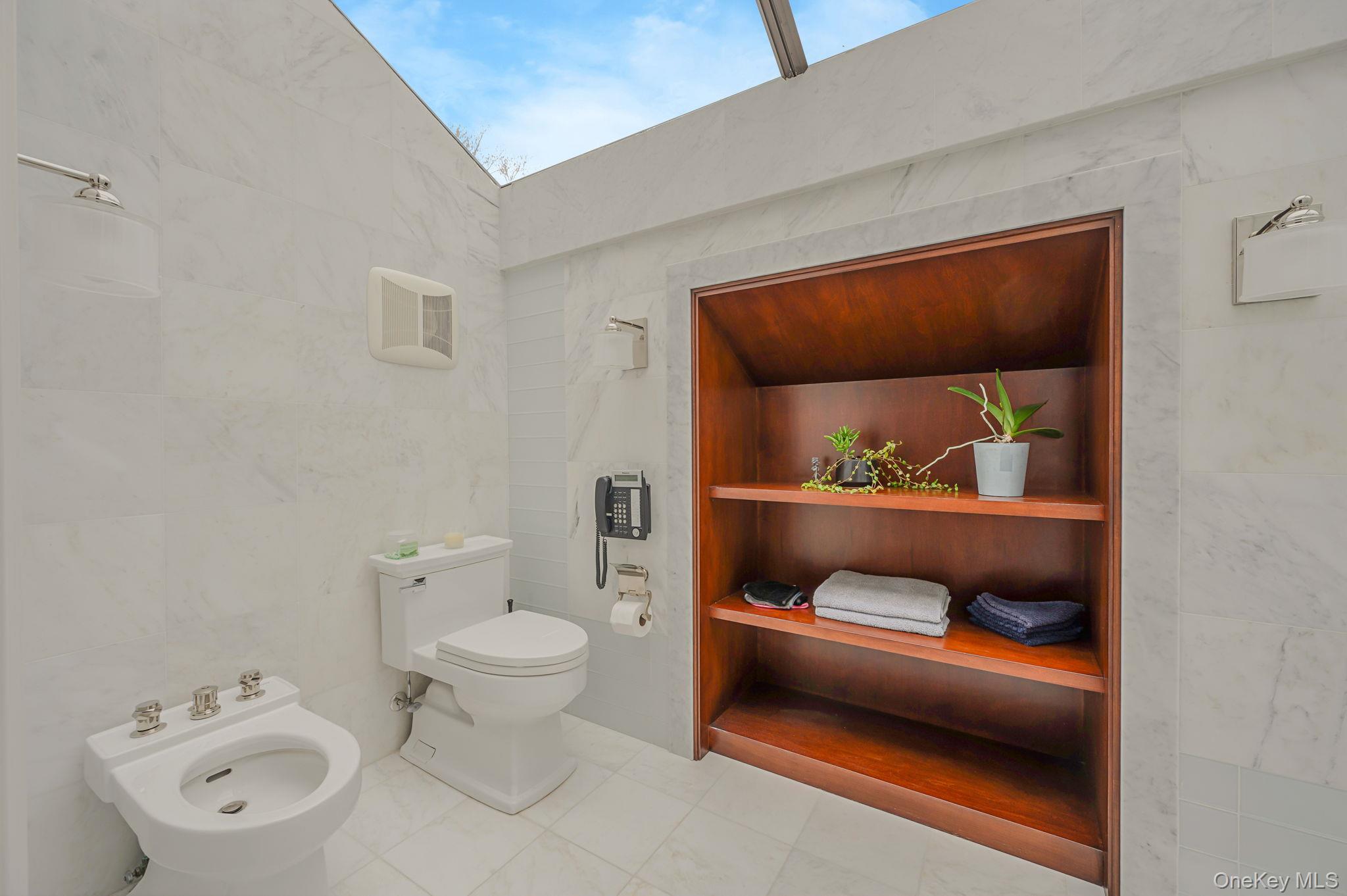 717 Short Beach Road St. James, NY 11780 - Photo 23 of 47 a bathroom with a toilet and a sink