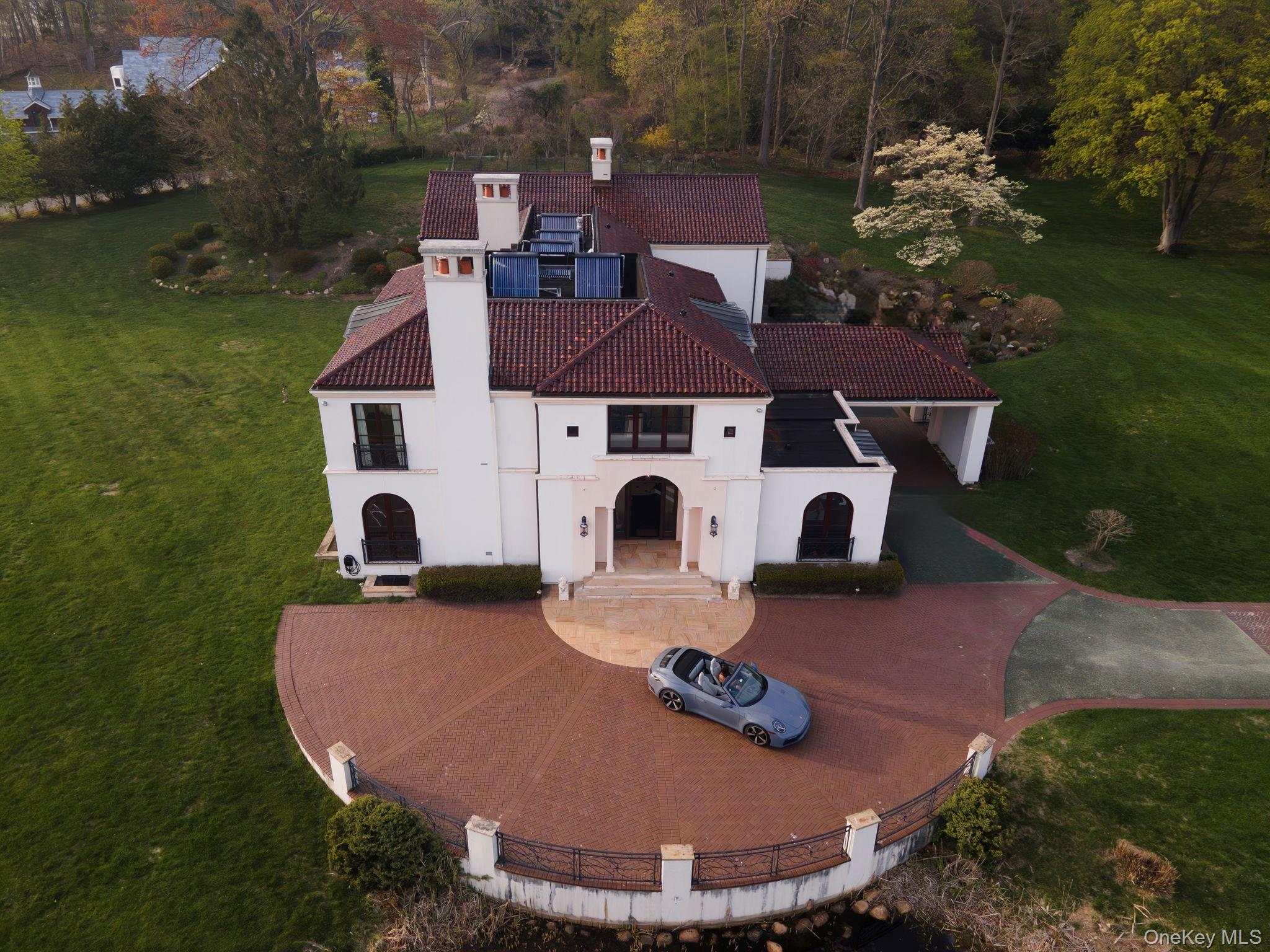 717 Short Beach Road St. James, NY 11780 - Photo 3 of 47 an aerial view of a house with outdoor space pool seating area and yard