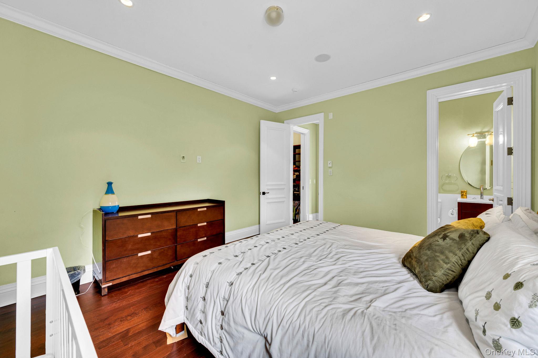 717 Short Beach Road St. James, NY 11780 - Photo 33 of 47 a bedroom with a bed and a dresser