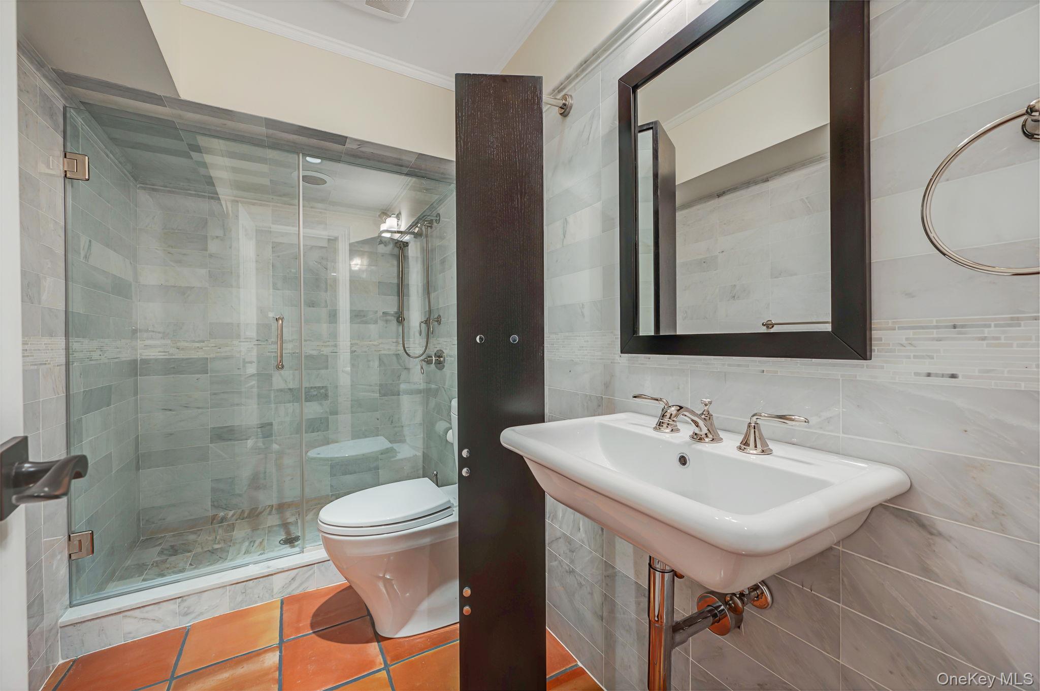 717 Short Beach Road St. James, NY 11780 - Photo 37 of 47 a bathroom with a sink toilet and shower