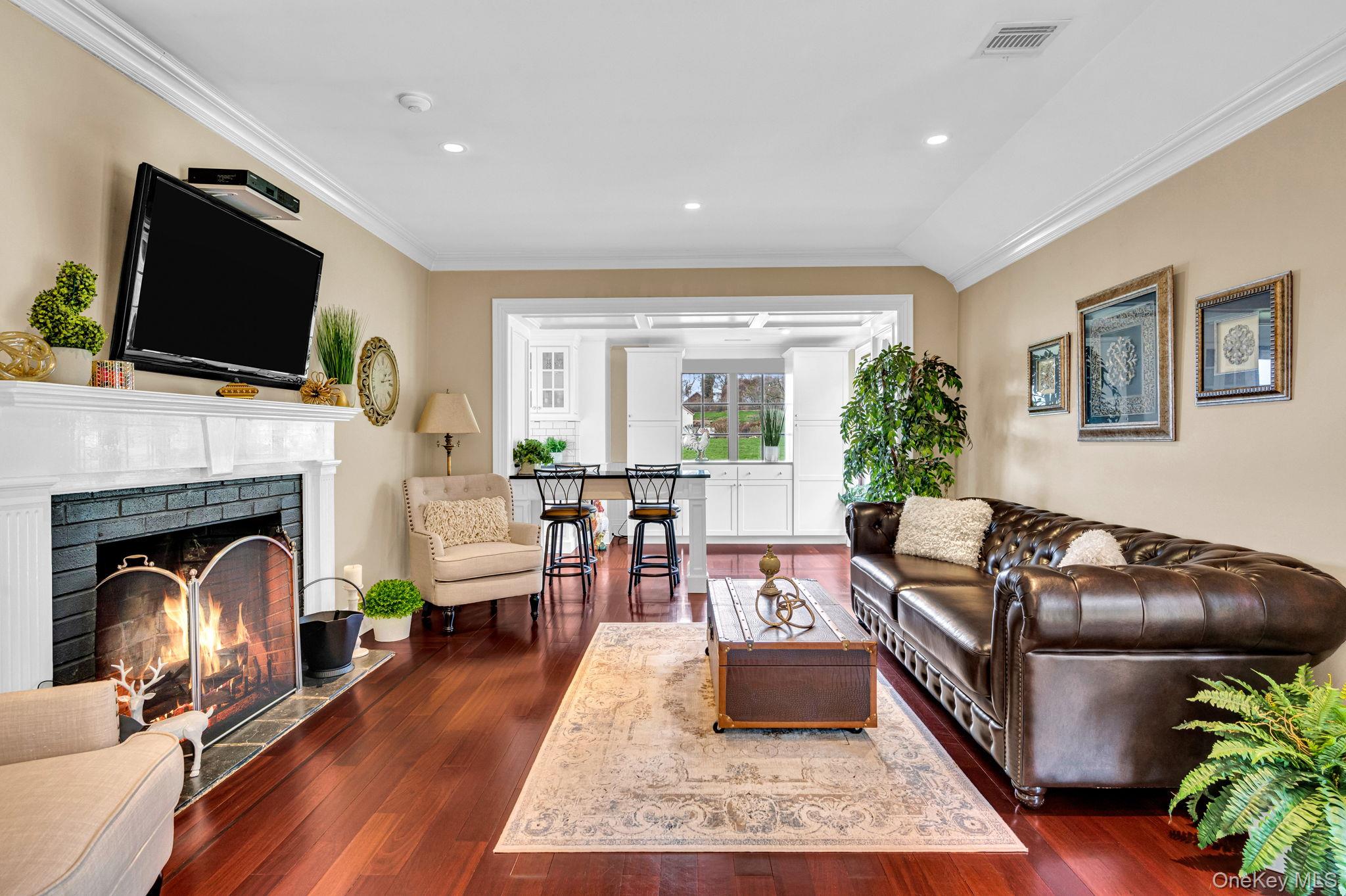 717 Short Beach Road St. James, NY 11780 - Photo 39 of 47 a living room with furniture fireplace and flat screen tv