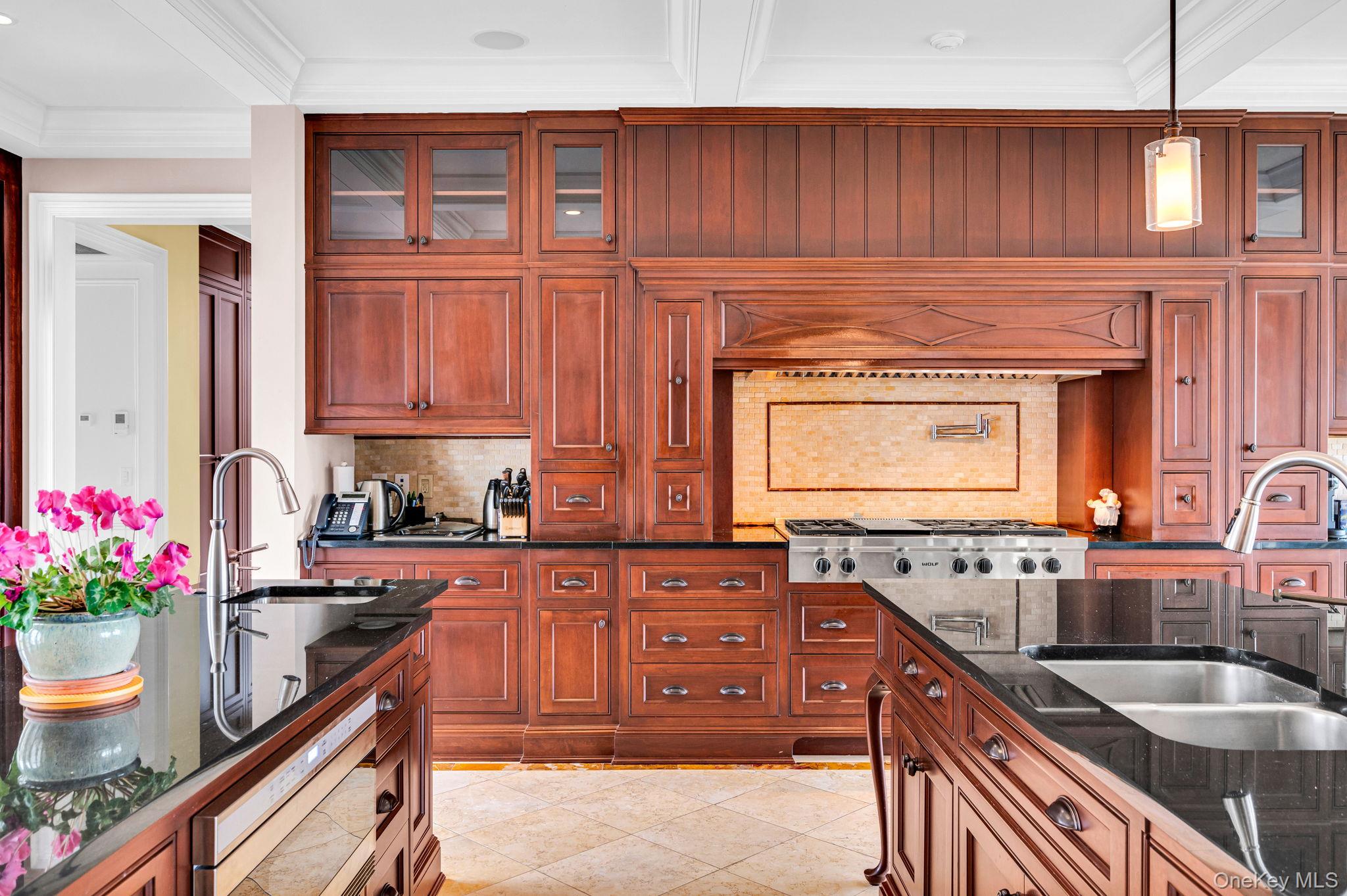 717 Short Beach Road St. James, NY 11780 - Photo 9 of 47 a kitchen with stainless steel appliances granite countertop a sink stove and cabinets