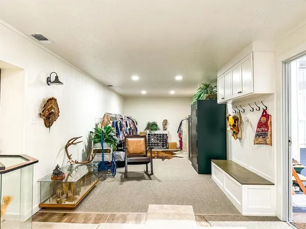 a living room with furniture and a rug