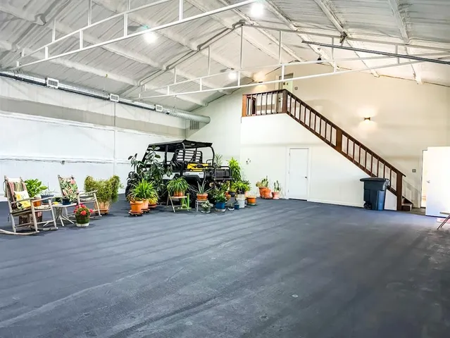 a view of a garage with a bike and table