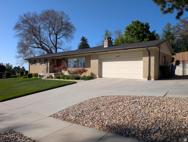1411 Millbrook Way Bountiful, UT 84010 - Photo 1 of 36 Ranch-style residence featuring a brick facade, attached two-car garage, and a concrete driveway