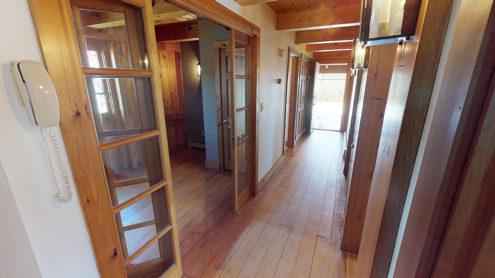 234 Madaket Road Nantucket, MA 02554 - Photo 43 of 50 Hallway for the three first-floor bedrooms, garage, and laundry/utility room.
