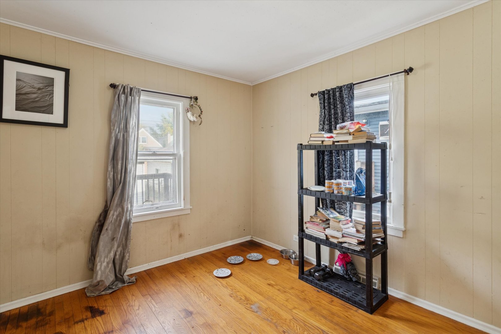 3731 Grove Avenue Berwyn, IL 60402 - Photo 9 of 14 a view of a livingroom with wooden floor and a window