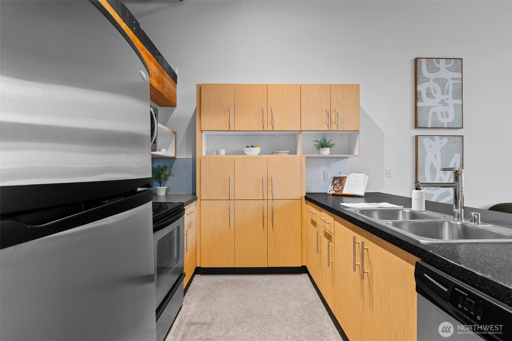 401 9th Avenue North, Unit 504 Seattle, WA 98109 - Photo 11 of 38 a kitchen with a sink and a refrigerator