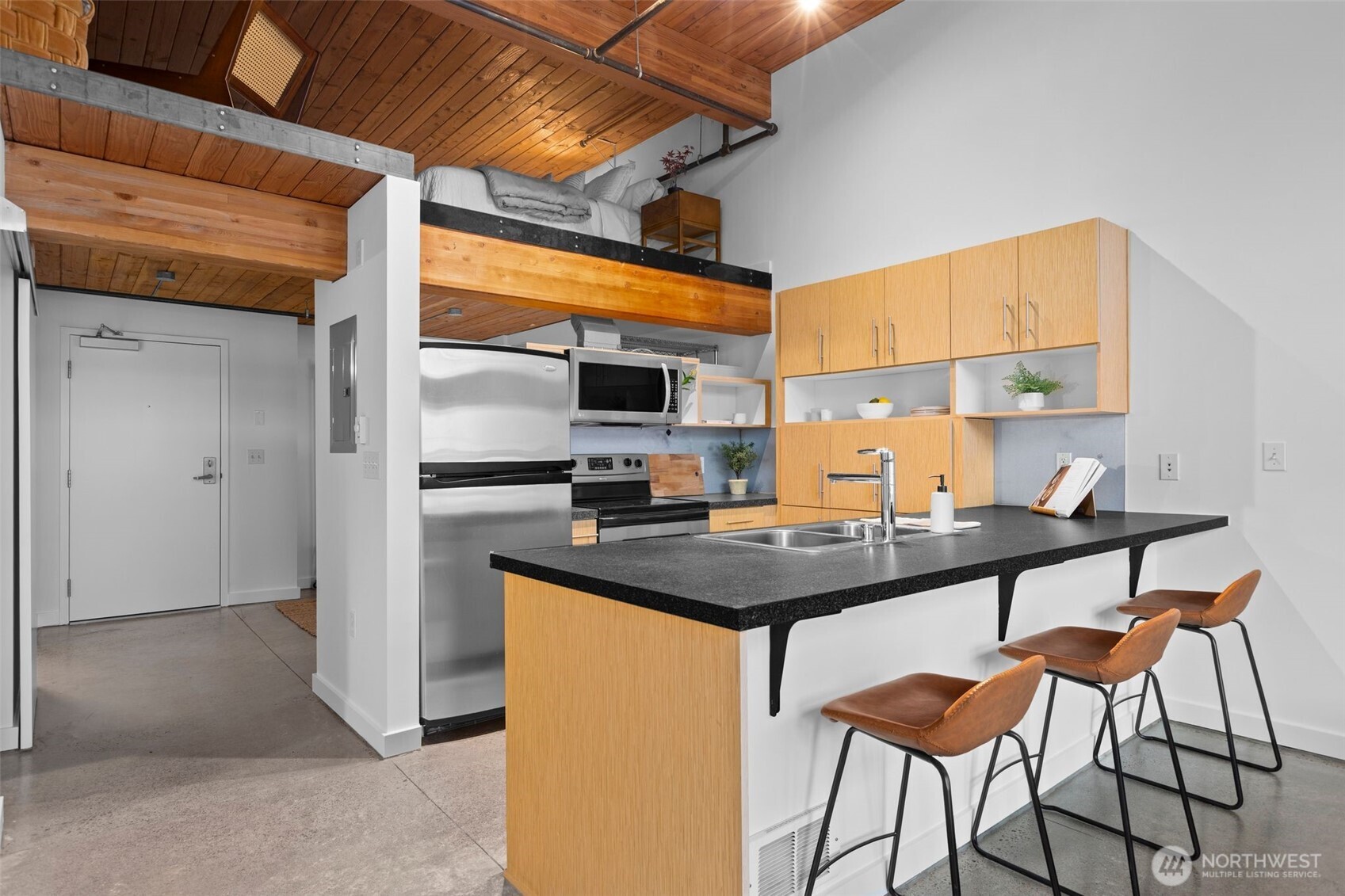 401 9th Avenue North, Unit 504 Seattle, WA 98109 - Photo 12 of 38 a kitchen with stainless steel appliances a sink a stove and a refrigerator