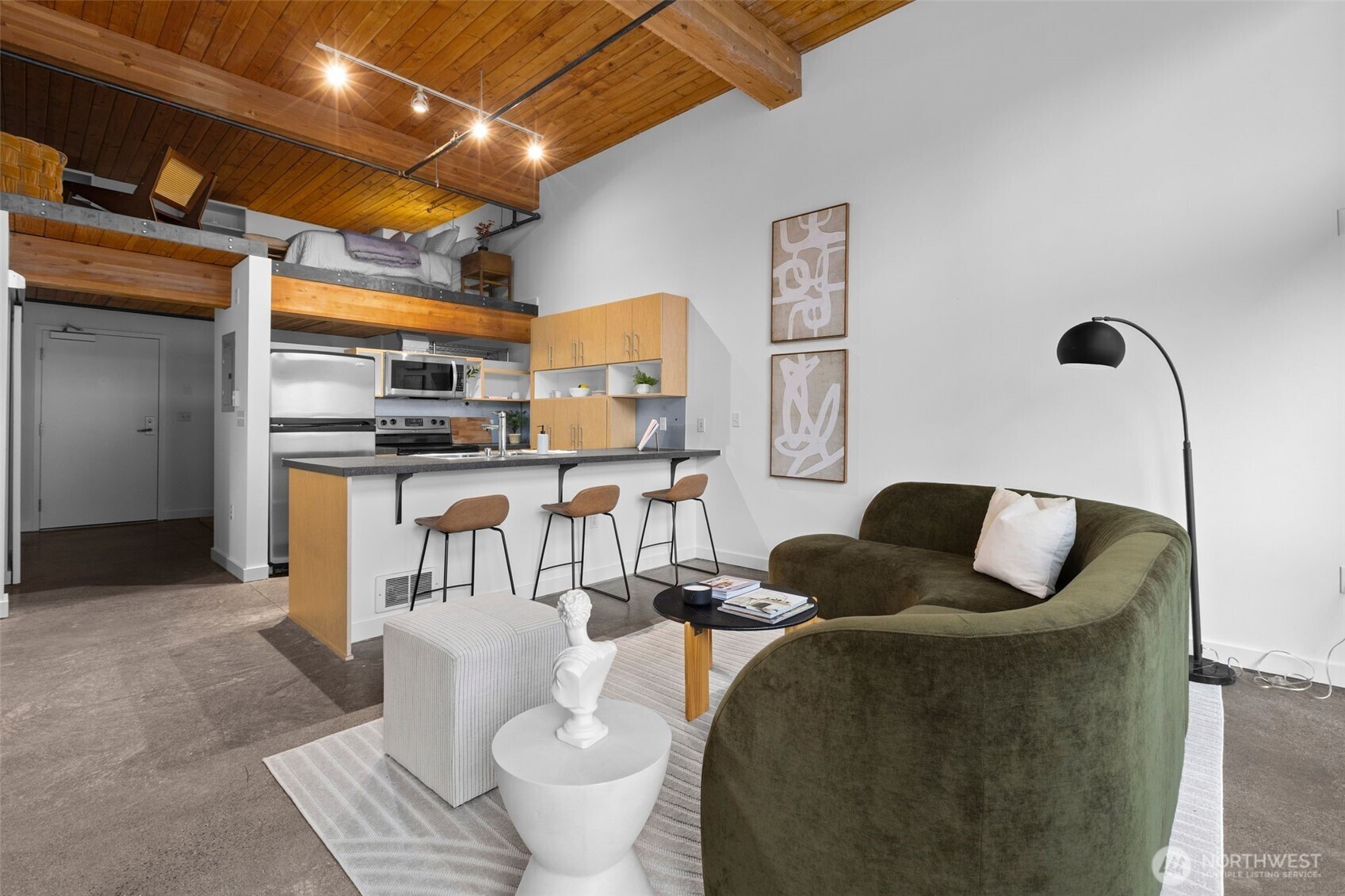 401 9th Avenue North, Unit 504 Seattle, WA 98109 - Photo 18 of 38 a living room with furniture and a kitchen view
