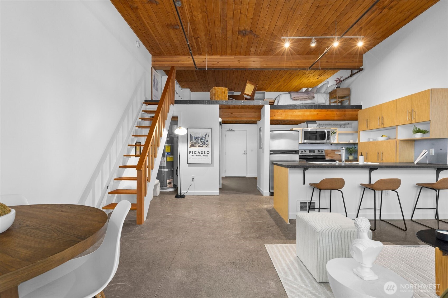 401 9th Avenue North, Unit 504 Seattle, WA 98109 - Photo 19 of 38 a living room with furniture and kitchen view