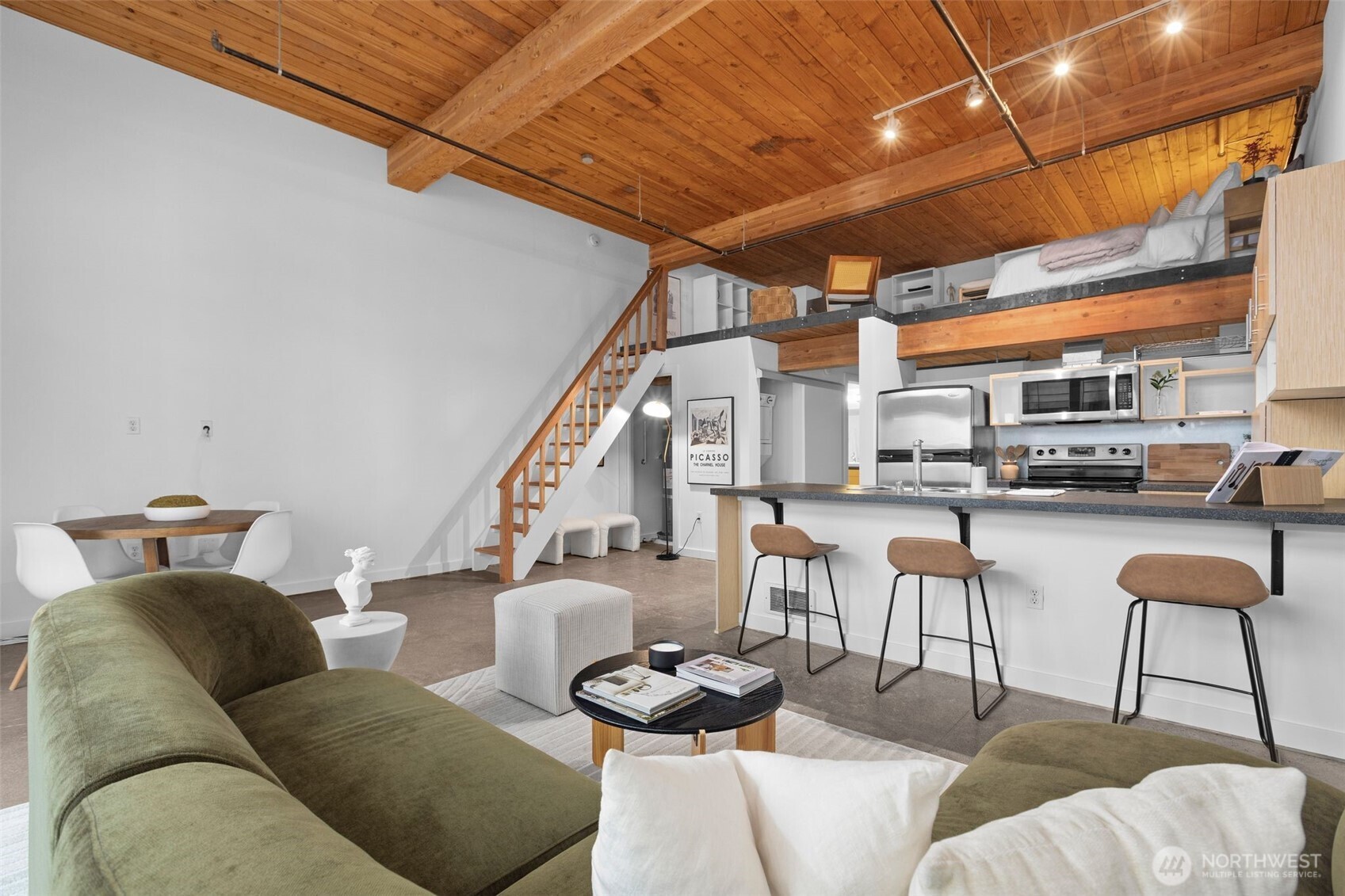 401 9th Avenue North, Unit 504 Seattle, WA 98109 - Photo 20 of 38 a living room with furniture and a chandelier