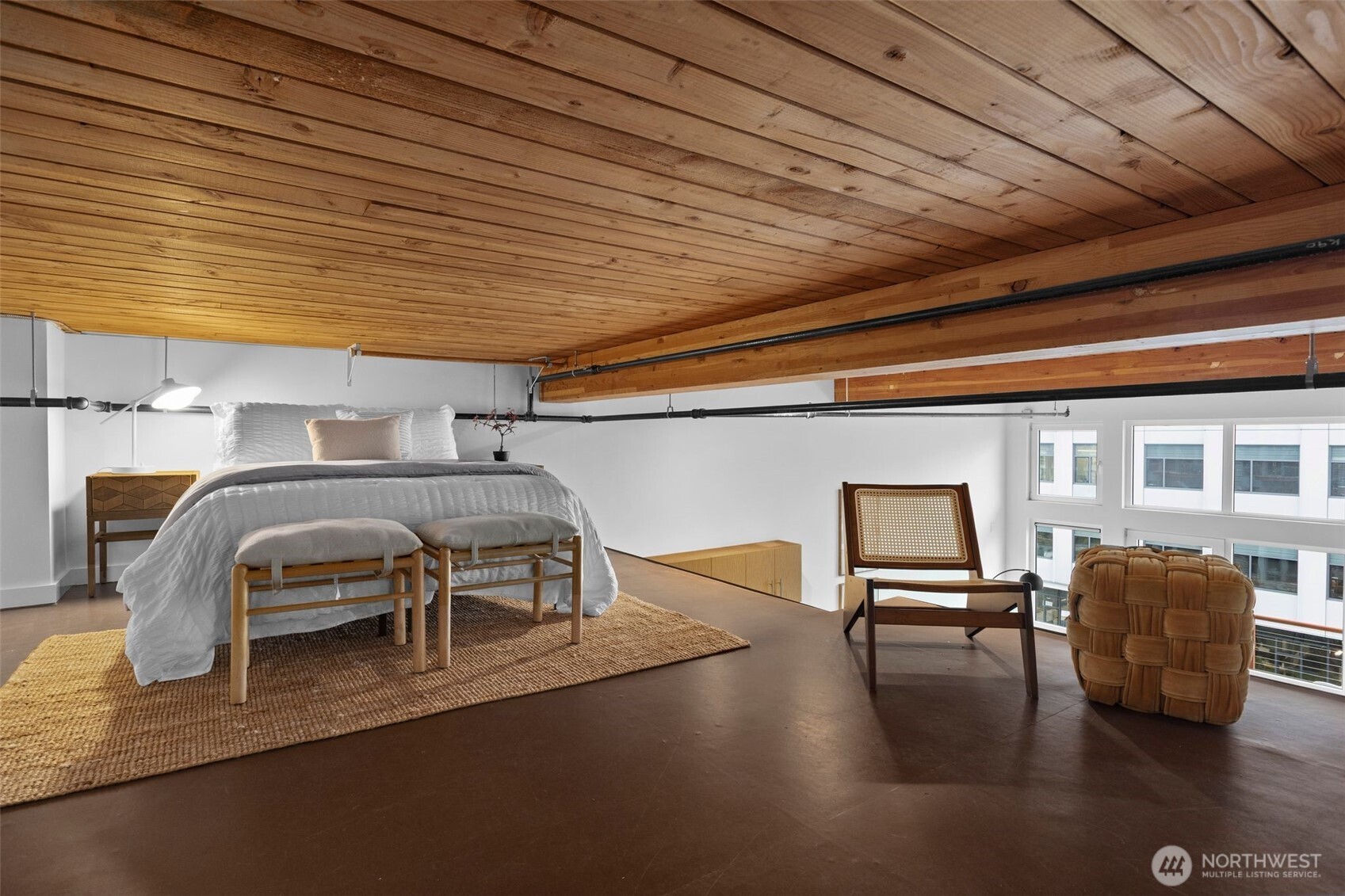 401 9th Avenue North, Unit 504 Seattle, WA 98109 - Photo 23 of 38 a bedroom with furniture and wooden floor