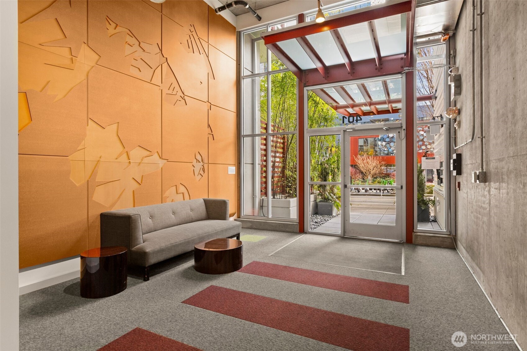 401 9th Avenue North, Unit 504 Seattle, WA 98109 - Photo 28 of 38 a living room with furniture and a floor to ceiling window